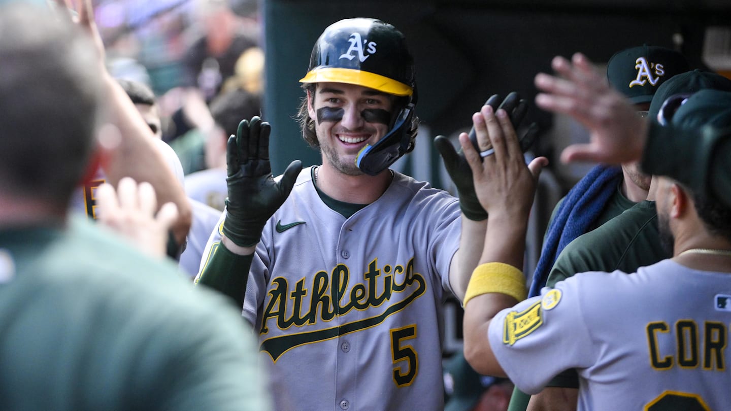 Sep 1, 2025; St. Louis, Missouri, USA;  Athletics shortstop Jacob Wilson (5) is congratulated by teammates after scoring against the St. Louis Cardinals during the seventh inning at Busch Stadium. Mandatory Credit: Jeff Curry-Imagn Images