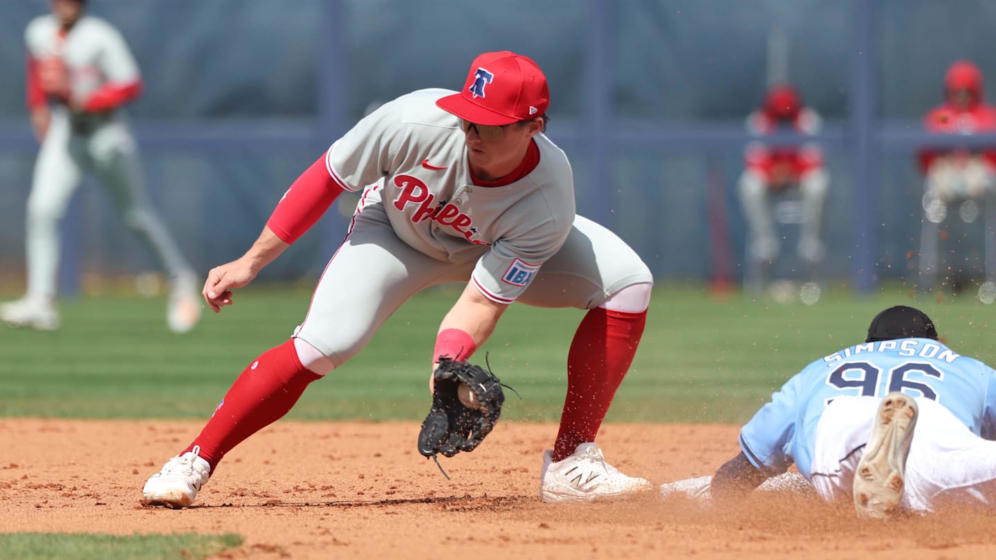 Feb 25, 2025; Port Charlotte, Florida, USA;  Tampa Bay Rays outfielder Chandler Simpson (96) slides safely into second base against Philadelphia Phillies infielder Aidan Miller (81) at Charlotte Sports Park.