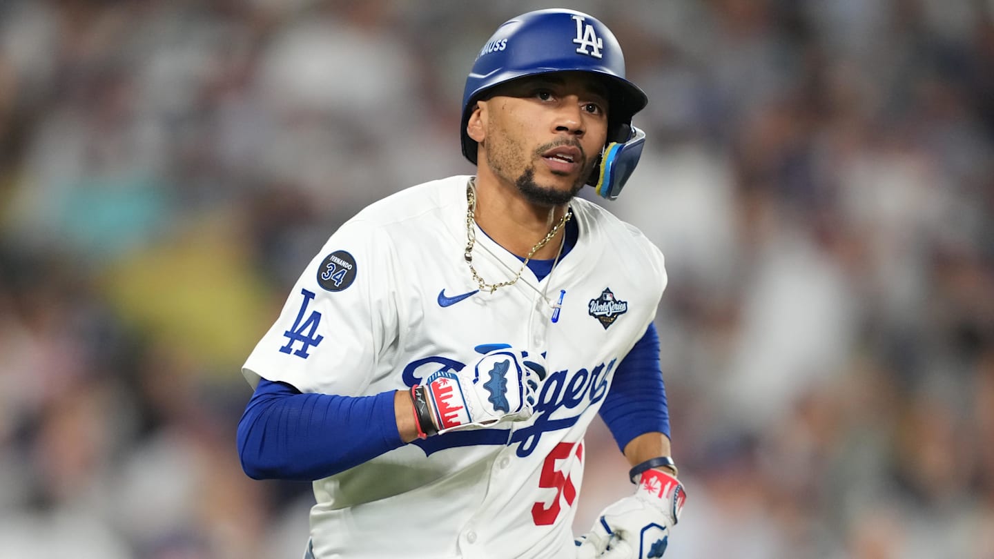 Oct 28, 2025; Los Angeles, California, USA; Los Angeles Dodgers shortstop Mookie Betts (50) runs after hitting a single against the Toronto Blue Jays in the eighth inning during game four of the 2025 MLB World Series at Dodger Stadium. Mandatory Credit: Kirby Lee-Imagn Images