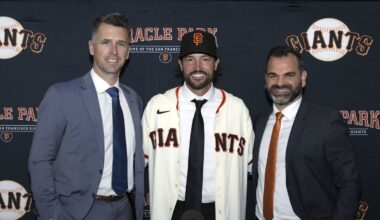 Oct 30, 2025; San Francisco, CA, USA;  Tony Vitello (center) is introduced as the new manager of the San Francisco Giants by president of baseball operations Buster Posey (left) and general manager Zack Minasian at Oracle Park. Mandatory Credit: D. Ross Cameron-Imagn Images