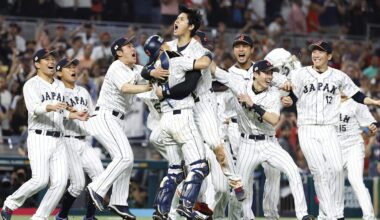 Mar 21, 2023; Miami, Florida, USA;  Japan designated hitter and closing pitcher Shohei Ohtani (16) and Japan catcher Yuhei Nakamura (27) and team Japan celebrate defeating the USA in the World Baseball Classic at LoanDepot Park. Mandatory Credit: Rhona Wise-Imagn Images