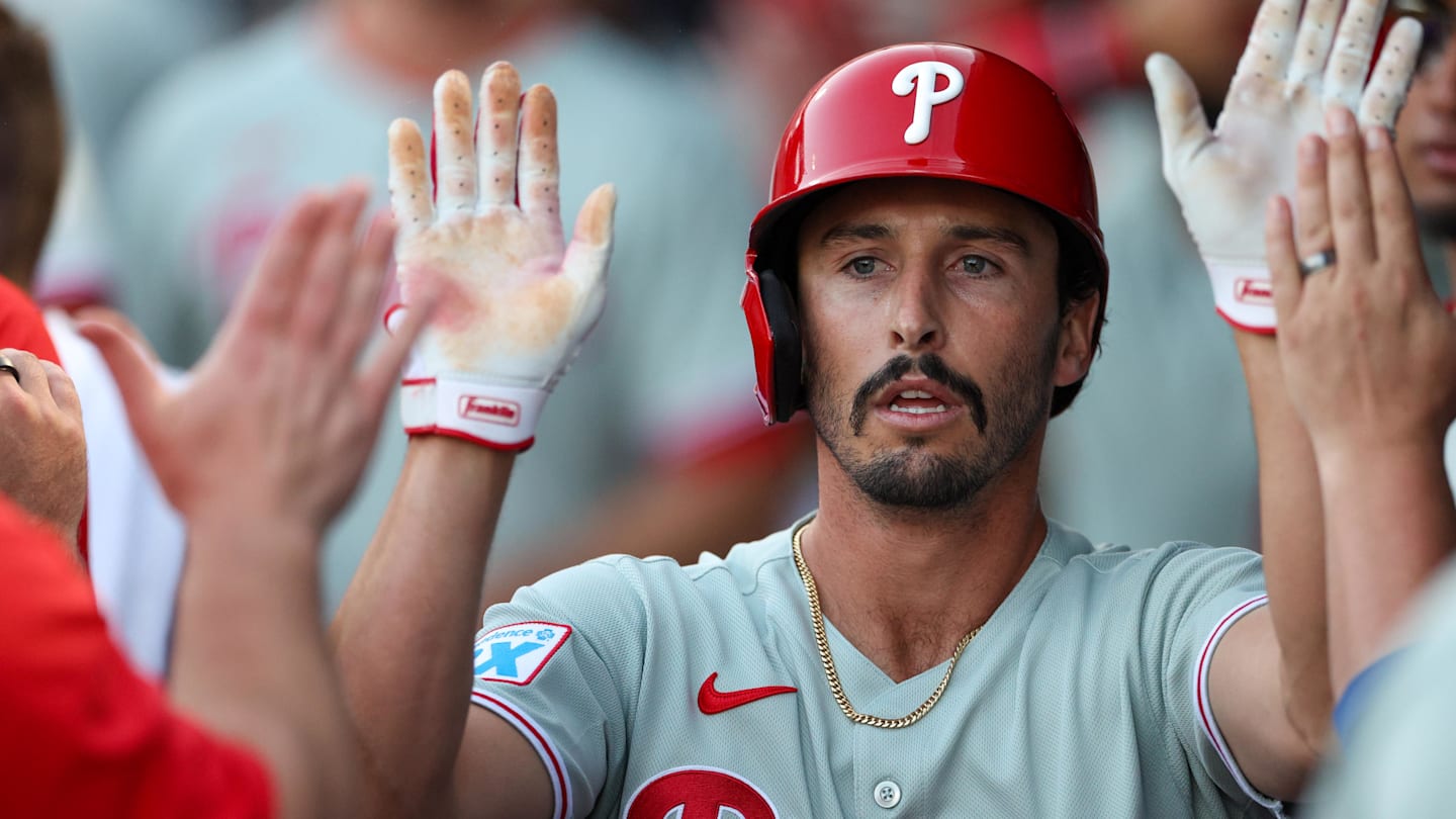 Mar 14, 2025; Tampa, Florida, USA; Philadelphia Phillies catcher Garrett Stubbs (21) celebrates after scoring a run against the New York Yankees in the second inning during spring training at George M. Steinbrenner Field.