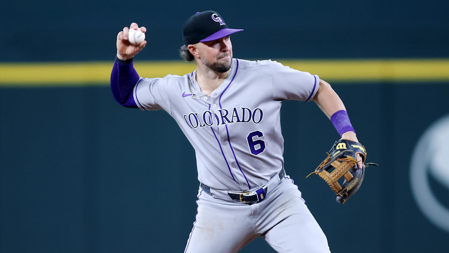 Colorado Rockies shortstop Kyle Farmer (6) throws
