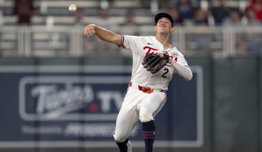 Sep 15, 2025; Minneapolis, Minnesota, USA; Minnesota Twins shortstop Brooks Lee (2) throws the ball to first base against the New York Yankees in the ninth inning at Target Field. Mandatory Credit: Jesse Johnson-Imagn Images