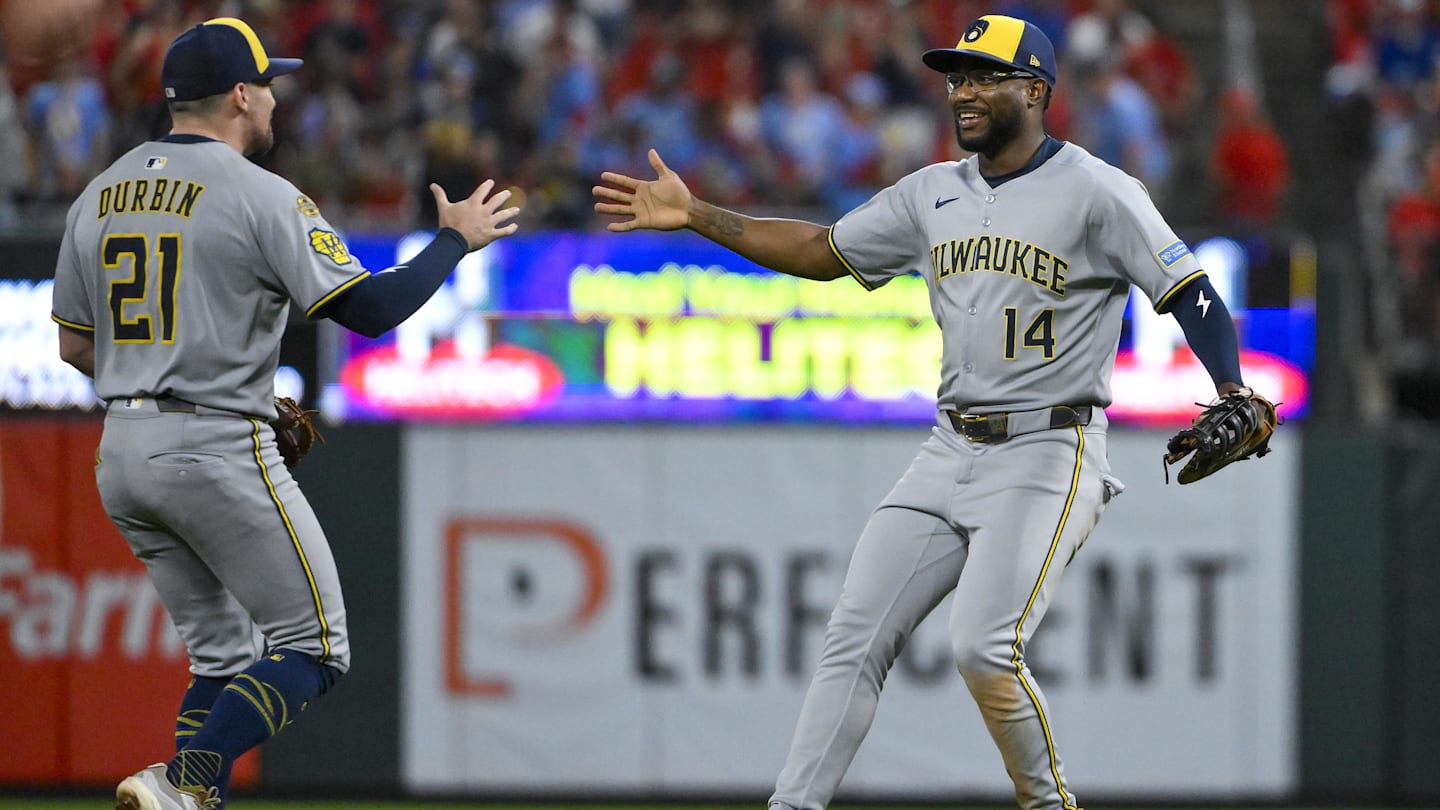 Sep 20, 2025: Milwaukee Brewers first baseman Andruw Monasterio (14) celebrates with third baseman Caleb Durbin (21) after the Brewers defeated the St. Louis Cardinals at Busch Stadium.