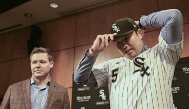 Dec 22, 2025; Chicago, Il, USA;  New Chicago White Sox player Munetaka Murakami, right, dons his hat with General Manager Chris Getz, left,  during a press conference  where he was introduced at Rate Field. Mandatory Credit: Matt Marton-Imagn Images