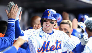 Mar 30, 2024; New York City, New York, USA;  New York Mets third baseman Brett Baty (22) is greeted in the dugout after hitting a pinch hit 3 run home run in the eighth inning against the Milwaukee Brewers at Citi Field. Mandatory Credit: Wendell Cruz-Imagn Images