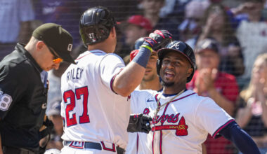 Apr 7, 2024; Cumberland, Georgia, USA; Atlanta Braves third baseman Austin Riley (27) reacts with second baseman Ozzie Albies (1) after hitting a home run against the Arizona Diamondbacks during the eighth inning at Truist Park. Mandatory Credit: Dale Zanine-Imagn Images