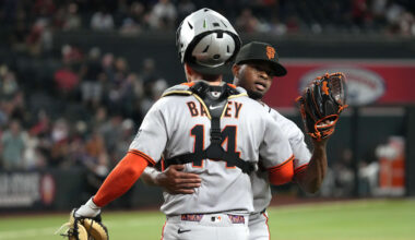 Sep 17, 2025; Phoenix, Arizona, USA; San Francisco Giants catcher Patrick Bailey (14) and pitcher Joel Peguero (63) celebrate after defeating the Arizona Diamondbacks at Chase Field. Mandatory Credit: Rick Scuteri-Imagn Images