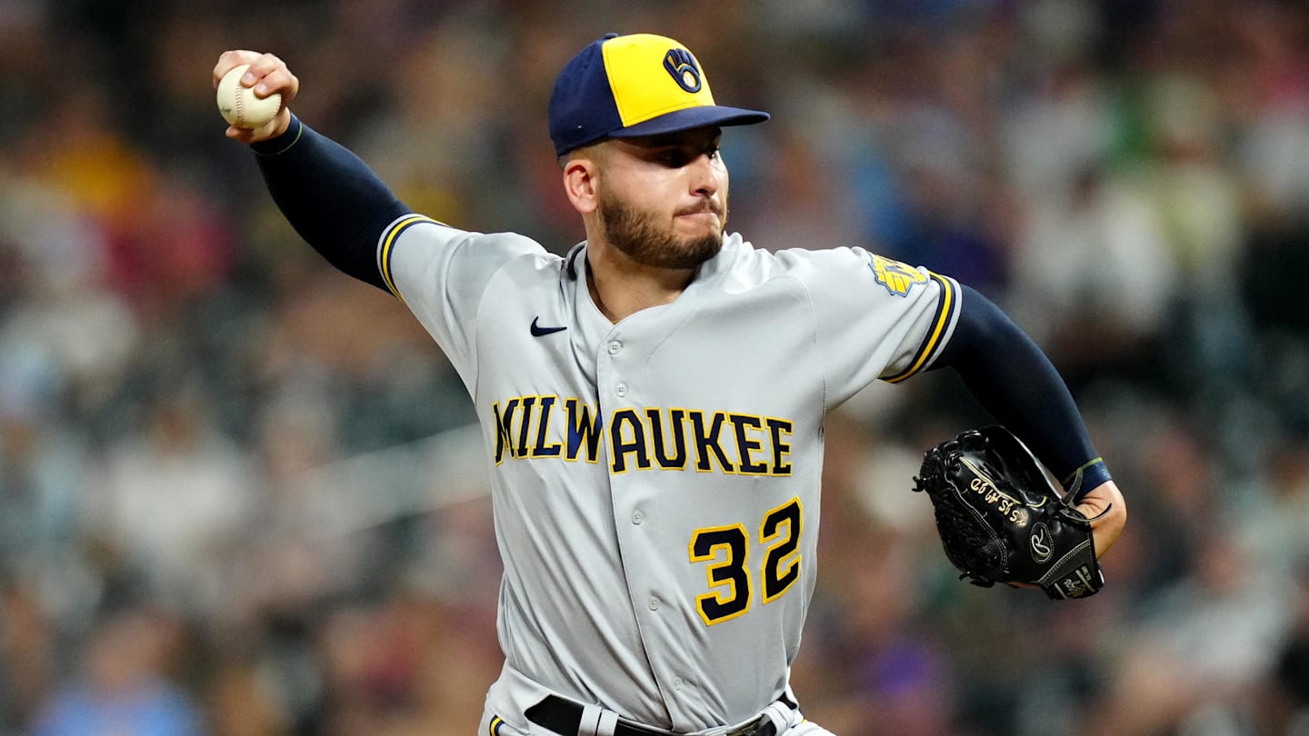 Sep 6, 2022; Denver, Colorado, USA; Milwaukee Brewers relief pitcher Peter Strzelecki (32) pitches in the ninth inning against the Colorado Rockies at Coors Field. Mandatory Credit: Ron Chenoy-Imagn Images