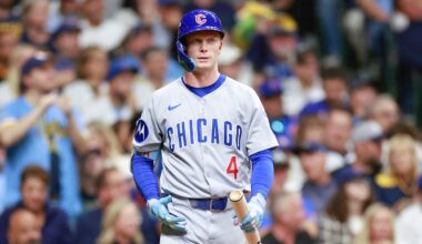 Preller speaks on the phone during NLCS workouts at Petco Park.
