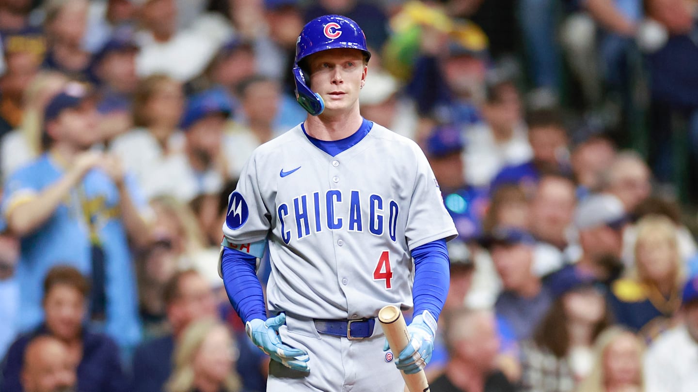 Preller speaks on the phone during NLCS workouts at Petco Park.