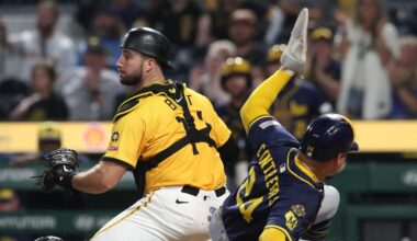 Sep 5, 2025; Pittsburgh, Pennsylvania, USA;  Milwaukee Brewers catcher William Contreras (24) slides behind Pittsburgh Pirates catcher Joey Bart (14) to score a run during the ninth inning at PNC Park. Mandatory Credit: Charles LeClaire-Imagn Images