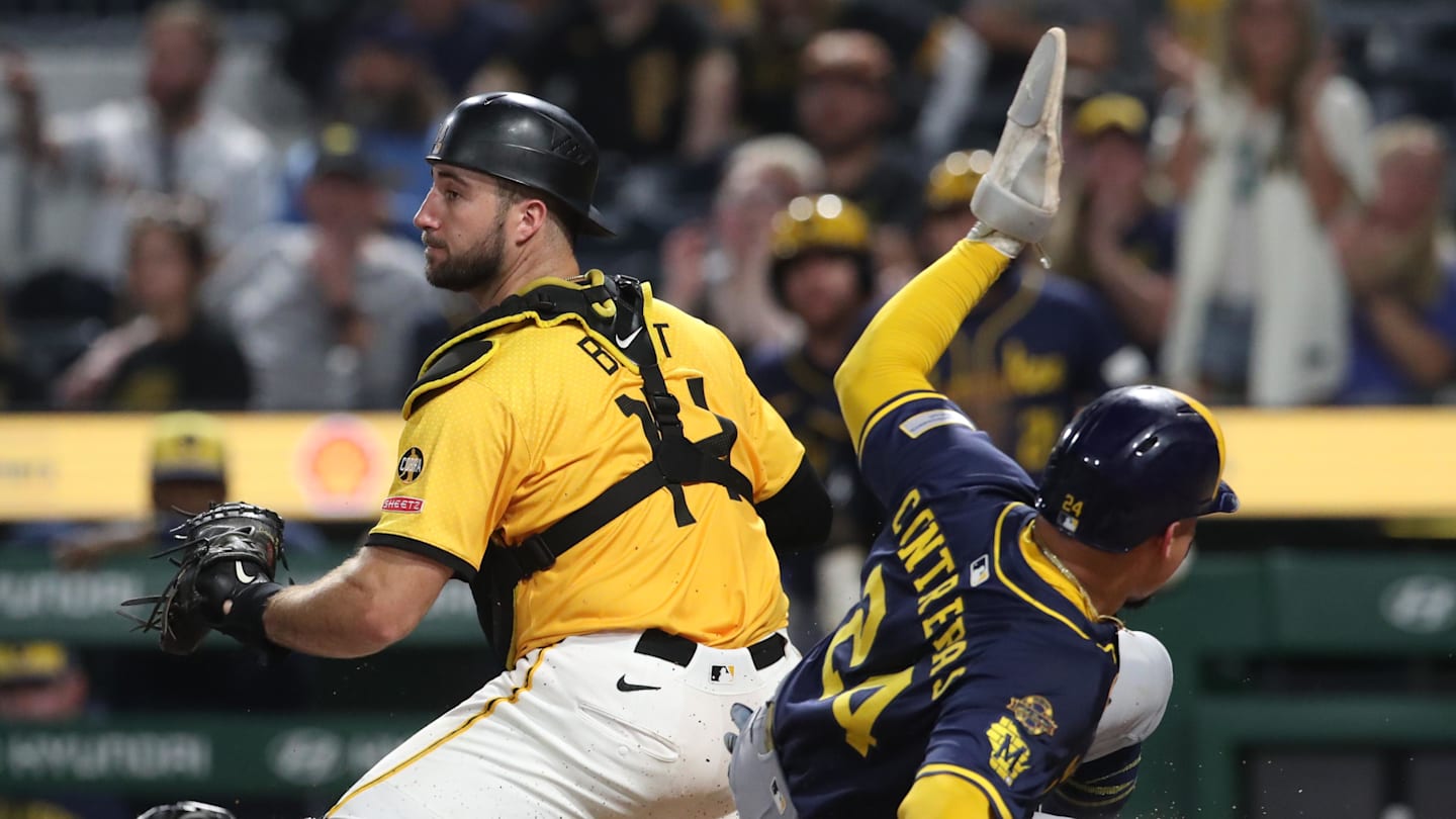 Sep 5, 2025; Pittsburgh, Pennsylvania, USA;  Milwaukee Brewers catcher William Contreras (24) slides behind Pittsburgh Pirates catcher Joey Bart (14) to score a run during the ninth inning at PNC Park. Mandatory Credit: Charles LeClaire-Imagn Images