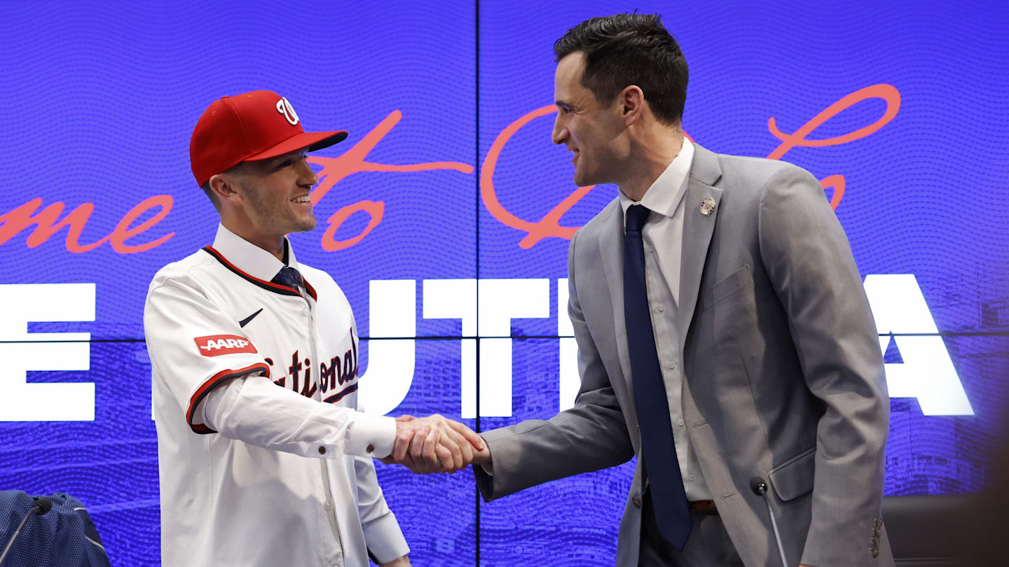 Nov 17, 2025; Washington, District of Columbia, USA;  Washington Nationals manager Blake Butera (L) shakes hands with Nationals general manager and president of baseball operations Paul Toboni (R) at an introductory press conference at Nationals Park. Mandatory Credit: Geoff Burke-Imagn Images