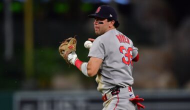 Jun 24, 2025; Anaheim, California, USA; Boston Red Sox second baseman Marcelo Mayer (39) loses control of the ball for the throw to first against Los Angeles Angels center fielder Jo Adell (7). during the seventh inning at Angel Stadium. Mandatory Credit: Gary A. Vasquez-Imagn Images