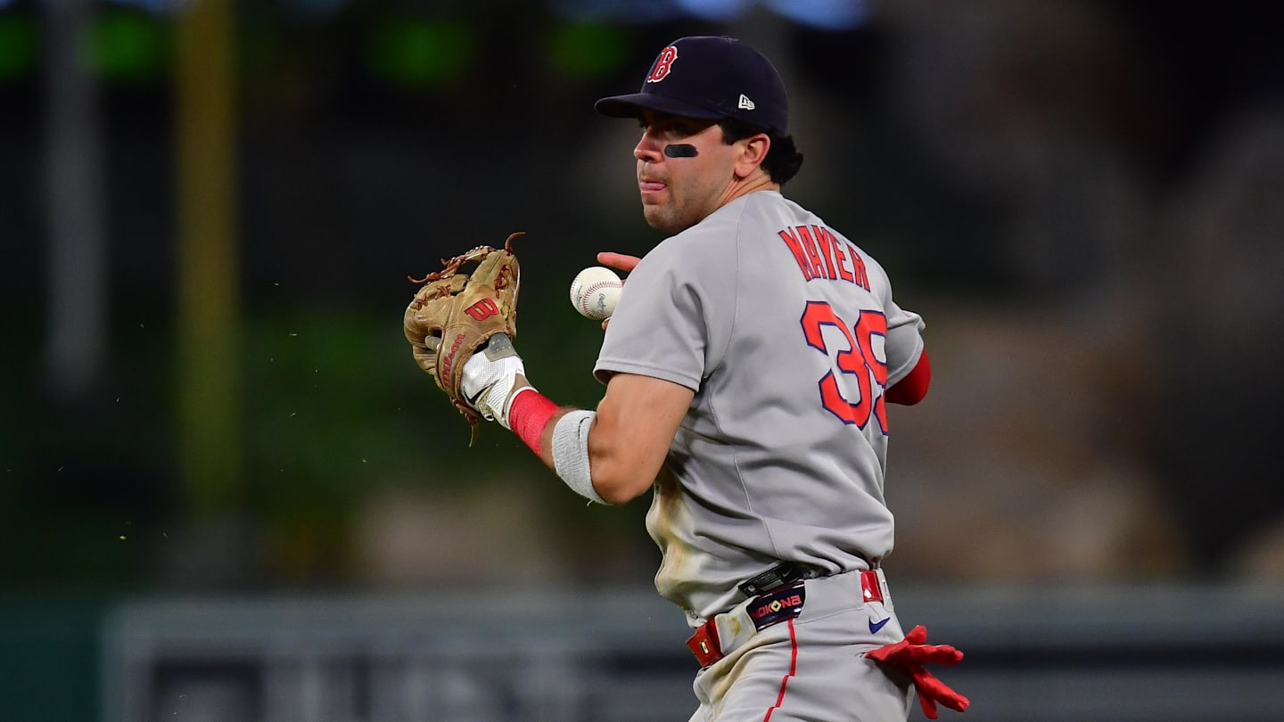 Jun 24, 2025; Anaheim, California, USA; Boston Red Sox second baseman Marcelo Mayer (39) loses control of the ball for the throw to first against Los Angeles Angels center fielder Jo Adell (7). during the seventh inning at Angel Stadium. Mandatory Credit: Gary A. Vasquez-Imagn Images