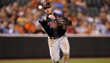 July 22, 2010; Baltimore, MD, USA; Minnesota Twins third baseman Nick Punto makes a throw to first base against the Baltimore Orioles at Oriole Park at Camden Yards.  Mandatory Credit: Rafael Suanes-Imagn Images