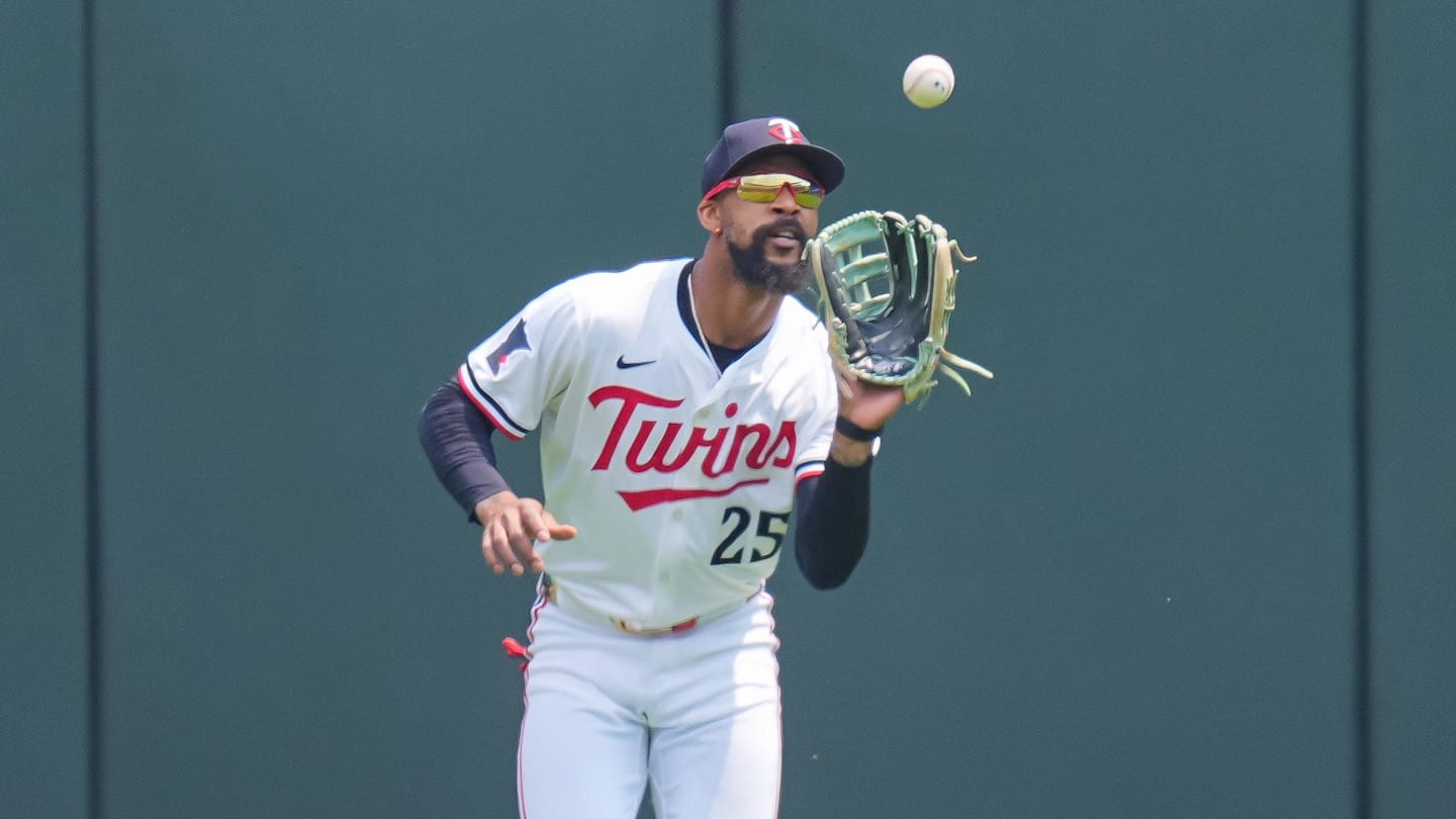 Jul 12, 2025; Minneapolis, Minnesota, USA; Minnesota Twins outfielder Byron Buxton (25) fields a fly ball against the Pittsburgh Pirates in the first inning at Target Field. Mandatory Credit: Brad Rempel-Imagn Images