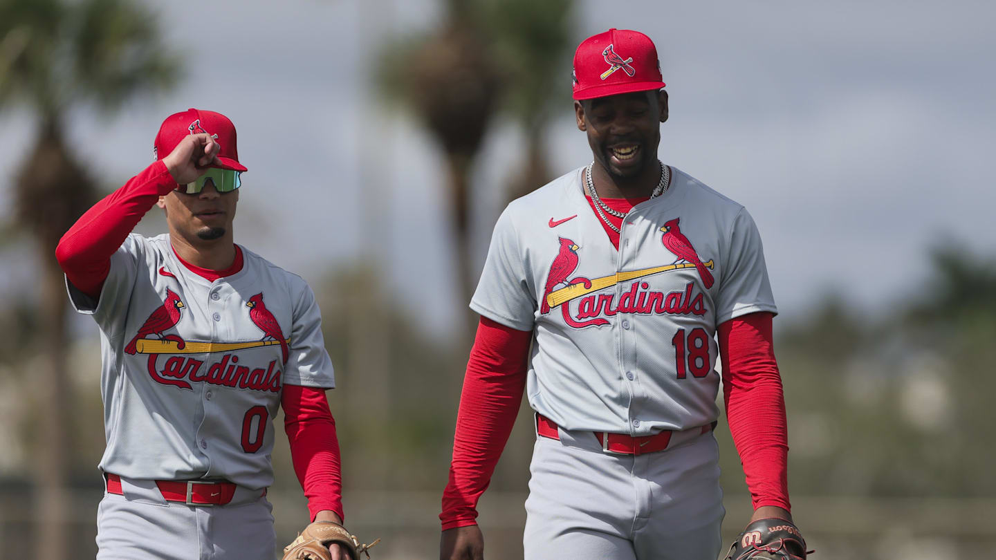 Feb 19, 2024; Jupiter, FL, USA; St. Louis Cardinals right fielder Jordan Walker (18) and shortstop Masyn Winn (0) react during a workout at spring training. Mandatory Credit: Sam Navarro-Imagn Images