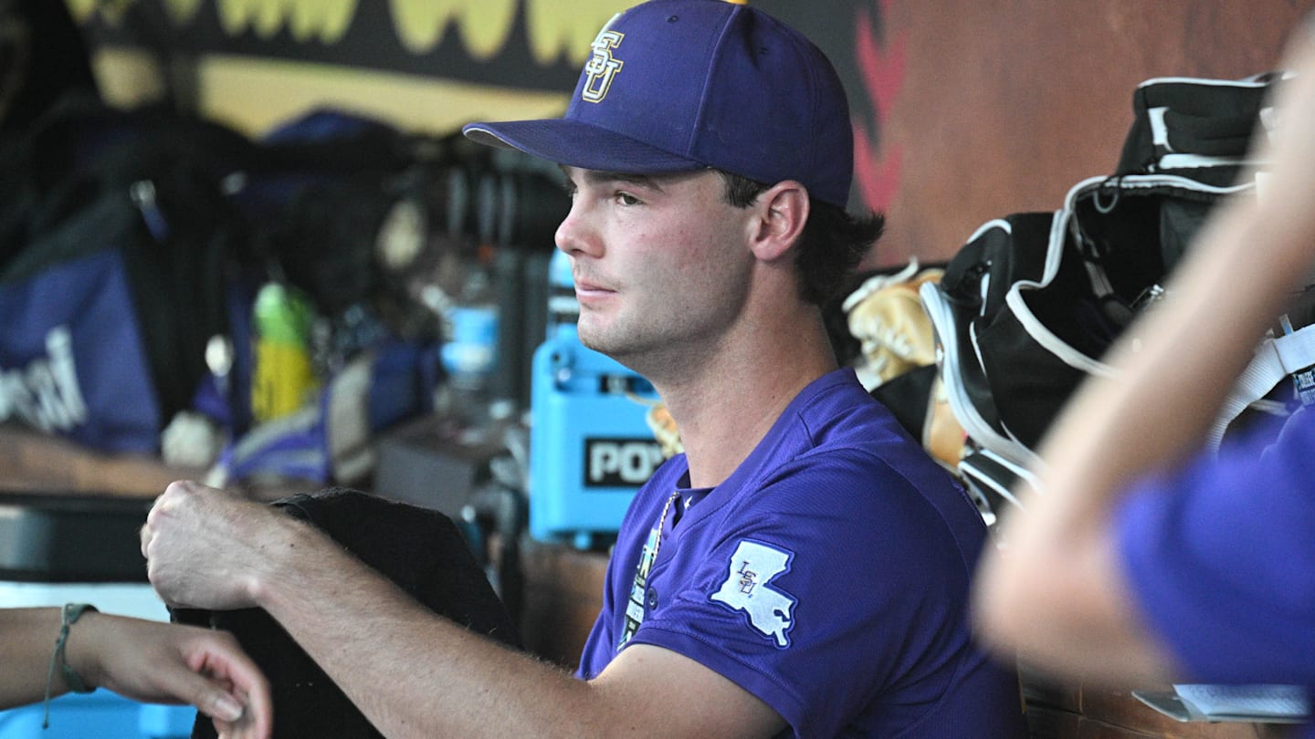 Jun 21, 2025; Omaha, Neb, USA;  LSU Tigers starting pitcher Kade Anderson (32) sits in the dugout between the eighth and ninth innings against the Coastal Carolina Chanticleers at Charles Schwab Field. Mandatory Credit: Steven Branscombe-Imagn Images