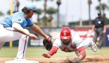 Mar 16, 2025; Jupiter, Florida, USA;  St. Louis Cardinals center fielder Victor Scott II (11) is picked off by Miami Marlins first baseman Jonah Bride (41) during the third inning  at Roger Dean Chevrolet Stadium. Mandatory Credit: Rhona Wise-Imagn Images