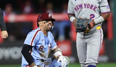 Sep 11, 2025; Philadelphia, Pennsylvania, USA; Philadelphia Phillies outfielder Nick Castellanos (8) reacts next to New York Mets second base Luisangel Acuna (2) after hitting a double during the sixth inning at Citizens Bank Park. Mandatory Credit: Bill Streicher-Imagn Images