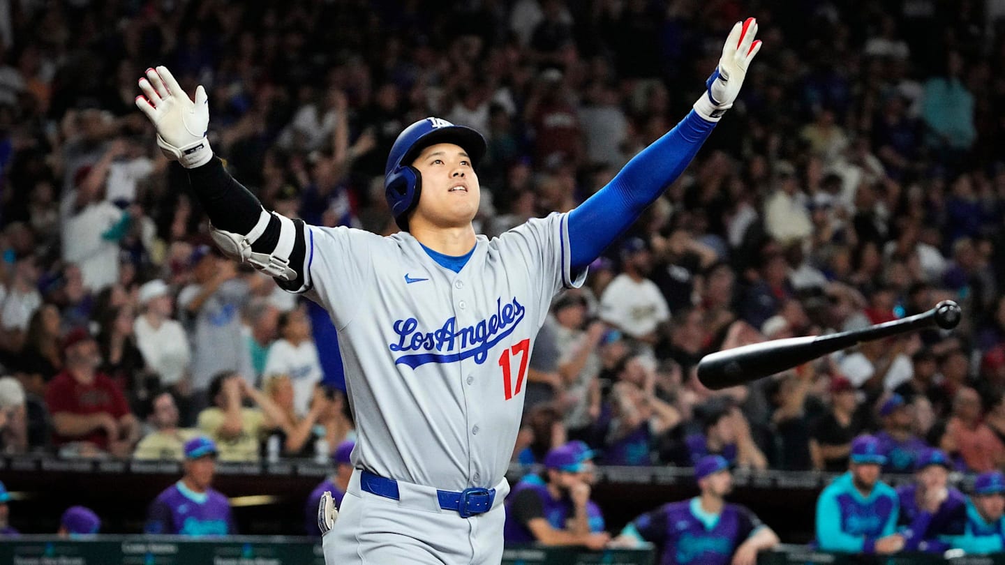 Los Angeles Dodgers Shohei Ohtani tosses his bat after hitting a three run home run against the Arizona Diamondbacks in the ninth inning at Chase Field in Phoenix on May 9, 2025. Mandatory Credit: Rob Schumacher-Arizona Republic