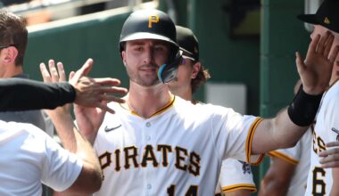 Jun 22, 2025; Pittsburgh, Pennsylvania, USA;  Pittsburgh Pirates catcher Joey Bart (14) high-fives in the dugout after scoring a run against the Texas Rangers during the fourth inning at PNC Park. Mandatory Credit: Charles LeClaire-Imagn Images