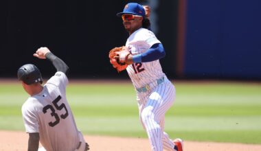 New York Mets shortstop Francisco Lindor attempts to turn a double play after forcing out Yankees left fielder Cody Bellinger.