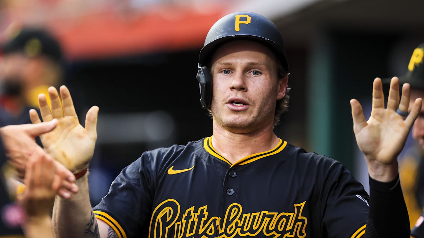 Jack Suwinski (65) high fives teammates after scoring on a RBI single.