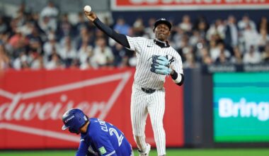 Oct 8, 2025; Bronx, New York, USA; New York Yankees second baseman Jazz Chisholm Jr. (13) forces out Toronto Blue Jays third baseman Ernie Clement (22) and tries to turn a double play during the eighth inning during game four of the ALDS round for the 2025 MLB playoffs at Yankee Stadium. Mandatory Credit: Vincent Carchietta-Imagn Images