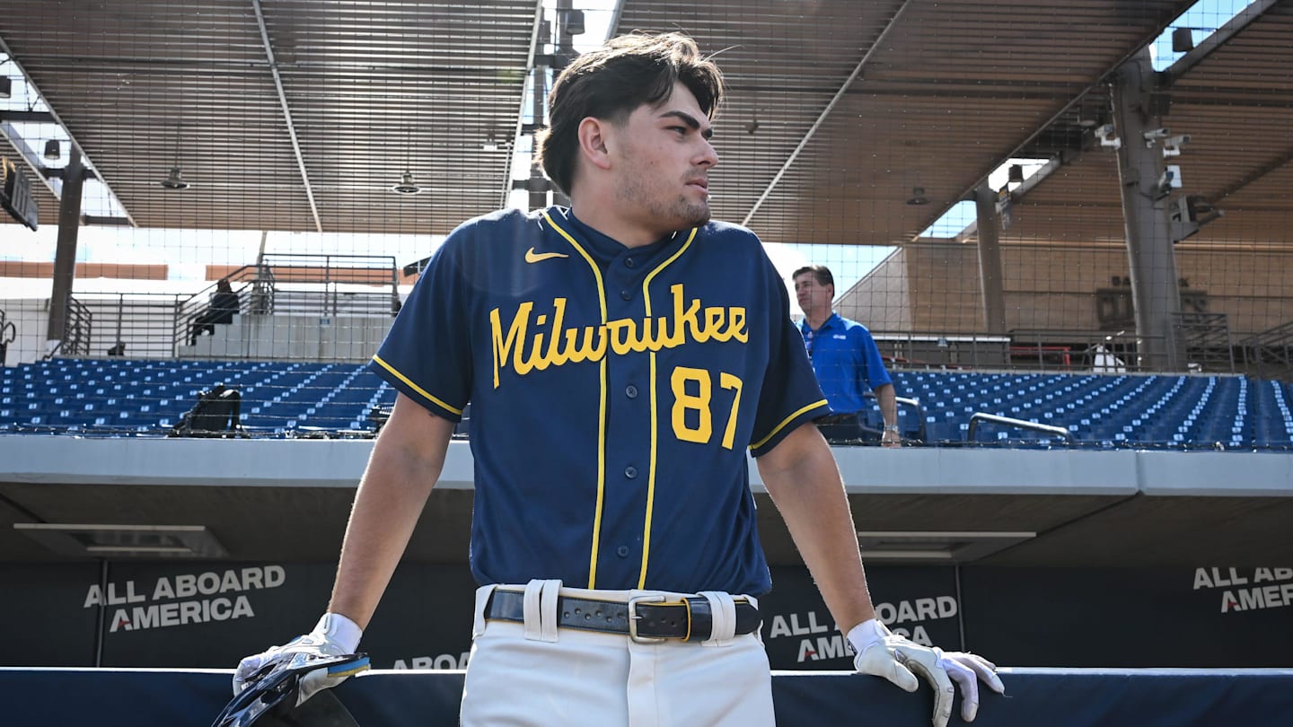 Milwaukee Brewers infield prospect Brady Ebel leans along the dugout rail during spring training workouts Tuesday, February 17, 2026, at American Family Fields of Phoenix in Phoenix, Arizona.