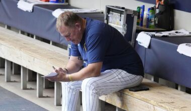 Jun 29, 2025; Milwaukee, Wisconsin, USA; Milwaukee Brewers manager Pat Murphy (49) works on his line card before their game against the Colorado Rockies at American Family Field. Mandatory Credit: Michael McLoone-Imagn Images