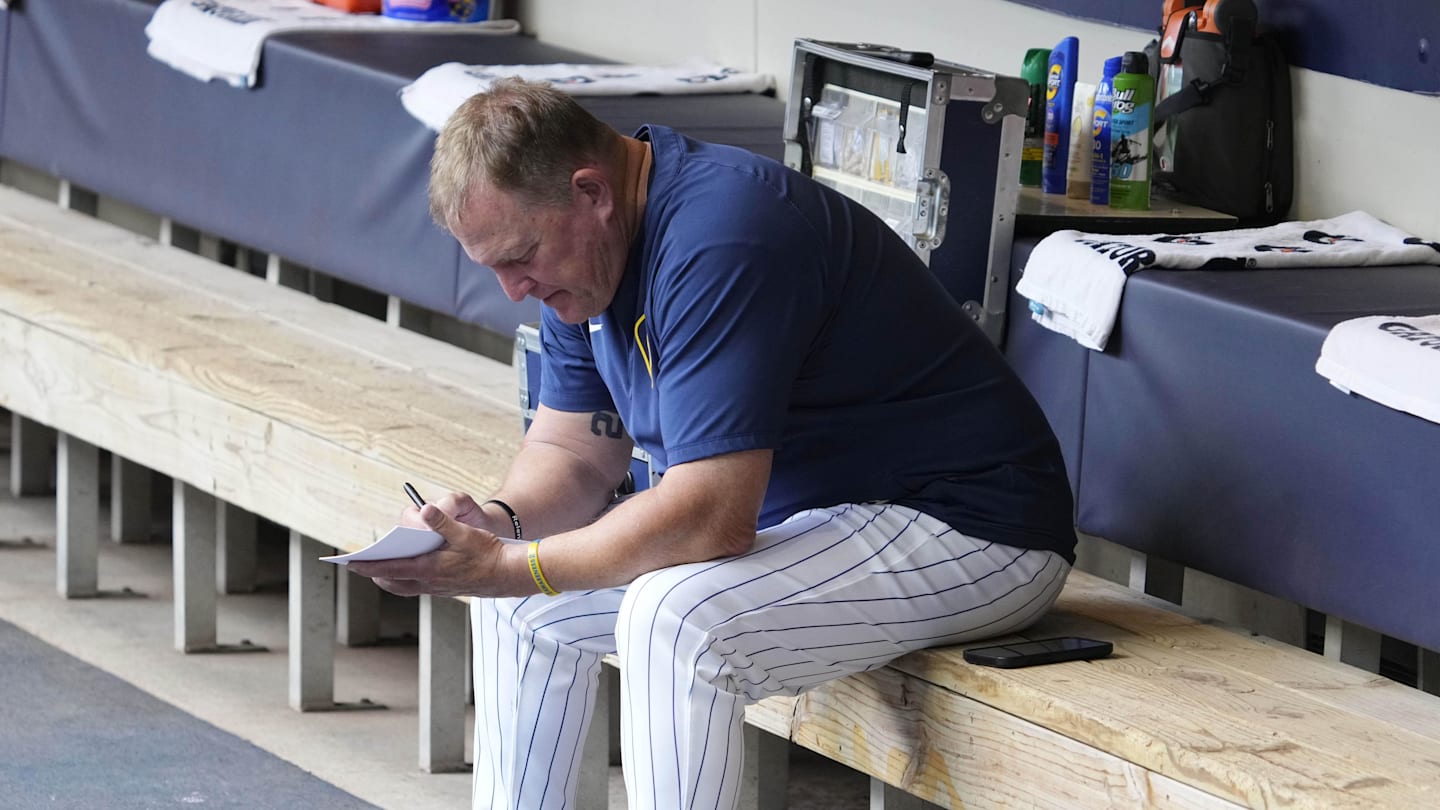 Jun 29, 2025; Milwaukee, Wisconsin, USA; Milwaukee Brewers manager Pat Murphy (49) works on his line card before their game against the Colorado Rockies at American Family Field. Mandatory Credit: Michael McLoone-Imagn Images
