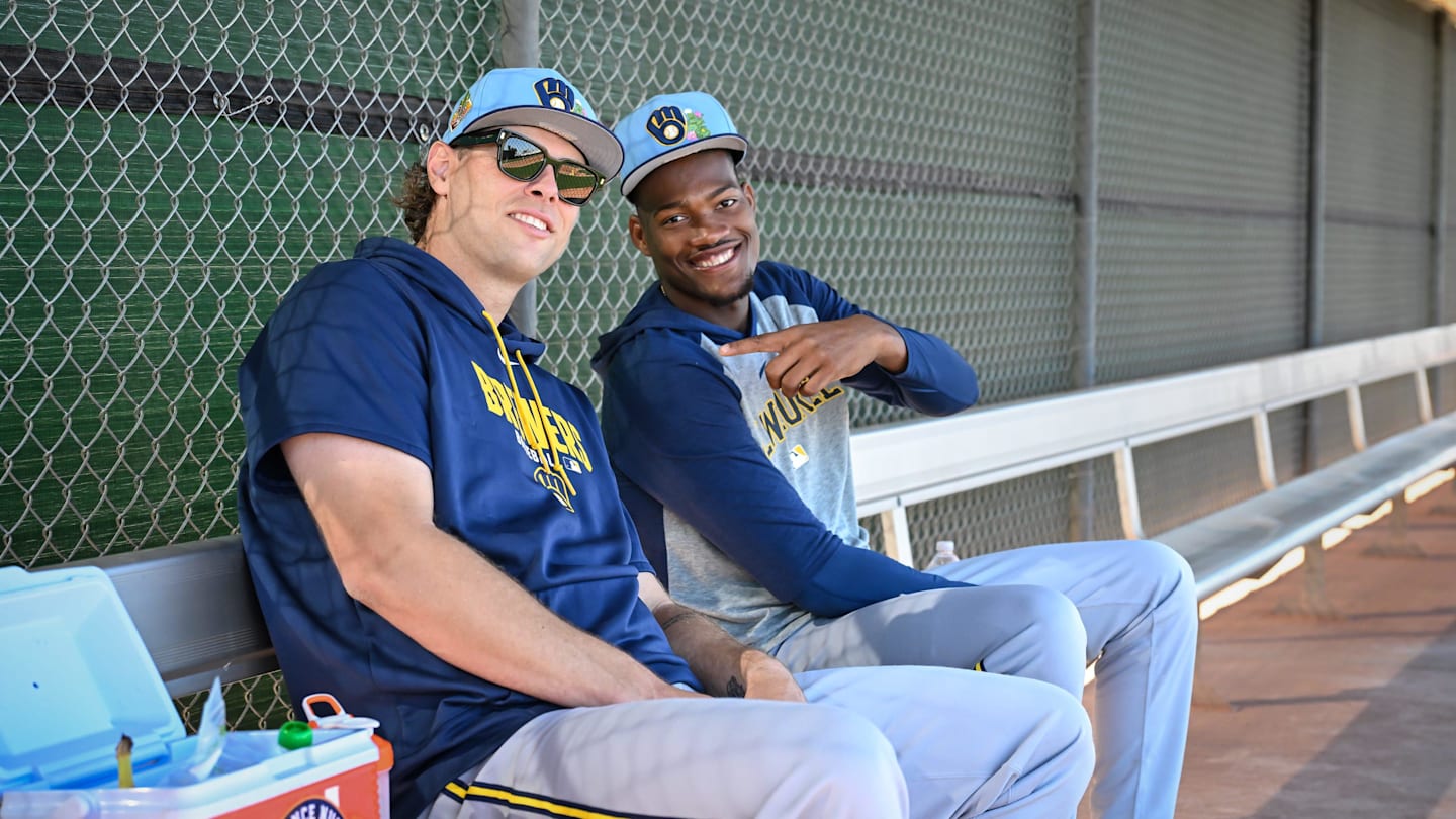 Milwaukee Brewers pitchers Trevor Megill, left, and pitcher Abner Uribe talk in the dugout during spring training workouts Saturday, February 14, 2026, at American Family Fields of Phoenix in Phoenix, Arizona.