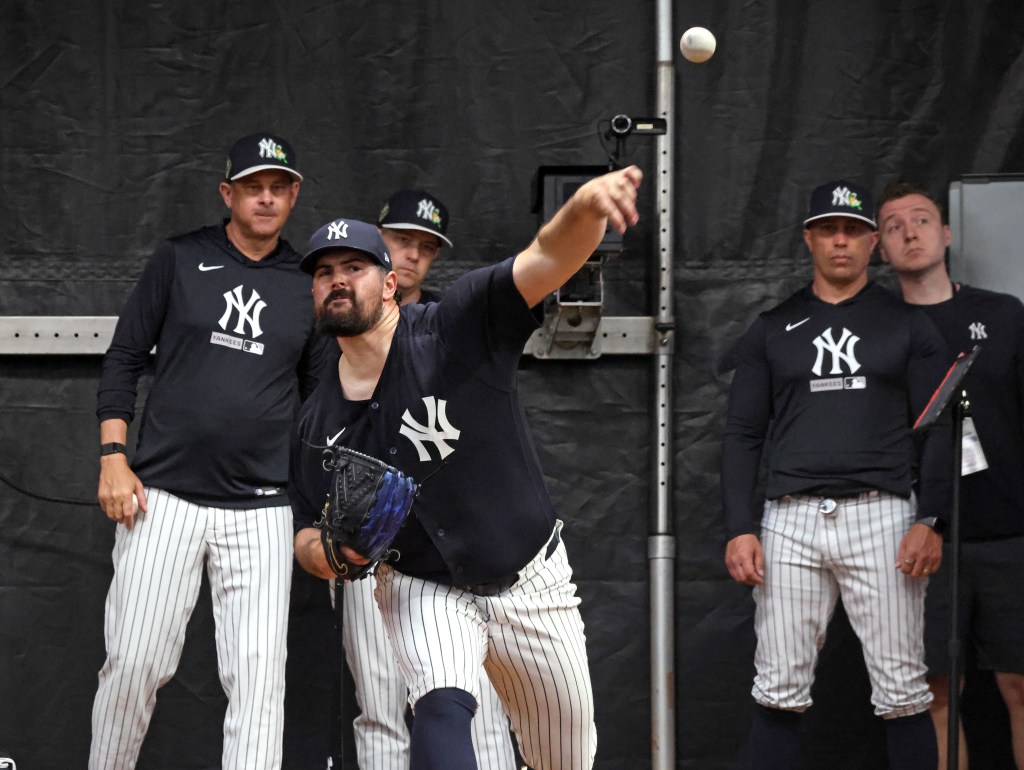 New York Yankees pitcher Carlos Rodón #55 throwing in the bullpen.