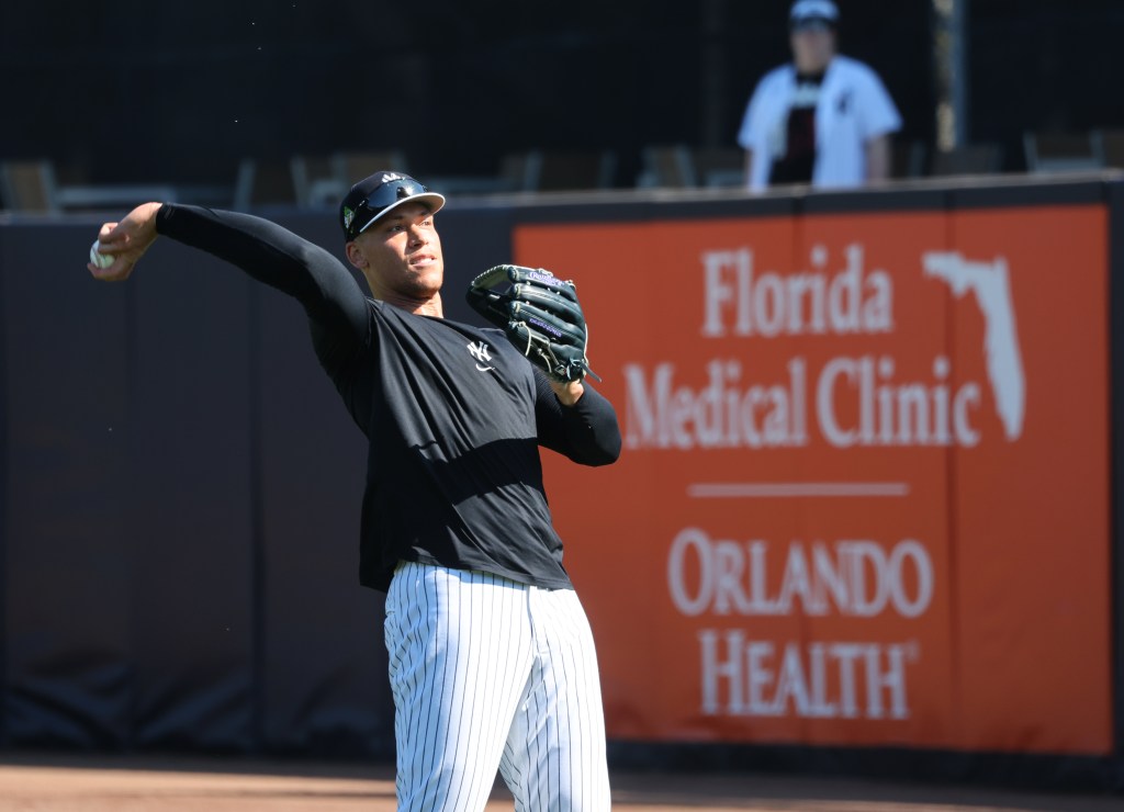 New York Yankees right fielder Aaron Judge #99, throwing a ball during todays workout at Steinbrenner Field, the Yankees Spring Training home in Tampa, Florida.