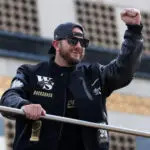 Los Angeles Dodgers third baseman Max Muncy acknowledges the crowd during the World Series championship parade at downtown Los Angeles.