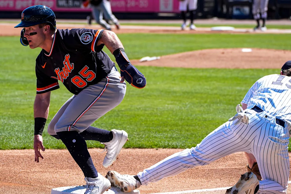 Detroit Tigers infielder Kevin McGonigle slides into third base past New York Yankees third baseman Ryan McMahon during the first inning at George M. Steinbrenner Field in Tampa, Fla. on Saturday, Feb. 21, 2026. McGonigle then scored on the catcher's throwing error.