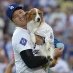 Los Angeles Dodgers designated hitter Shohei Ohtani (17) with his dog Decoy after he delivered he first pitch before the game against the Baltimore Orioles at Dodger Stadium on Aug 28, 2024.