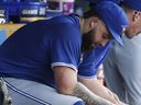 Toronto Blue Jays pitcher Alek Manoah sits on the bench after being pulled from a game last year.