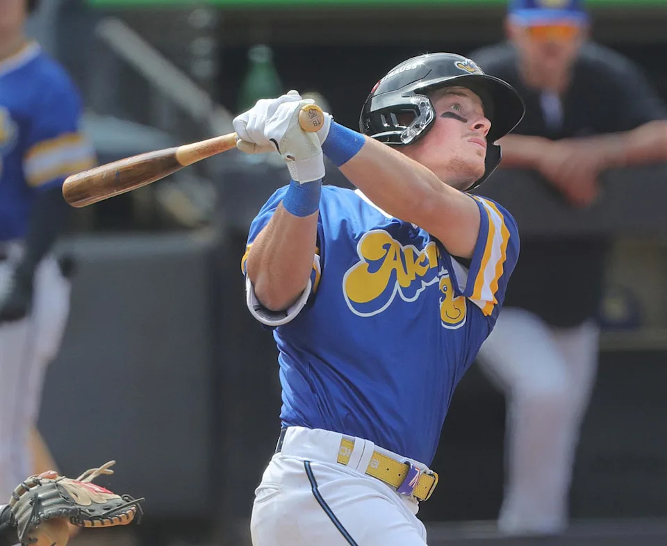 RubberDucks’ Travis Bazzana follows a long fly ball at the wall in a game against the Altoona Curve on April 13, 2025, in Akron, Ohio, at Canal Park. {Phil Masturzo/Beacon Journal}