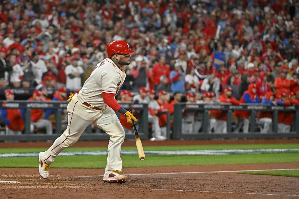 St. Louis Cardinals catcher Yadier Molina (4) hits a single for his final postseason at bat in the ninth inning against the Philadelphia Phillies during game two of the Wild Card series for the 2022 MLB Playoffs at Busch Stadium. Jeff Curry-Imagn Images