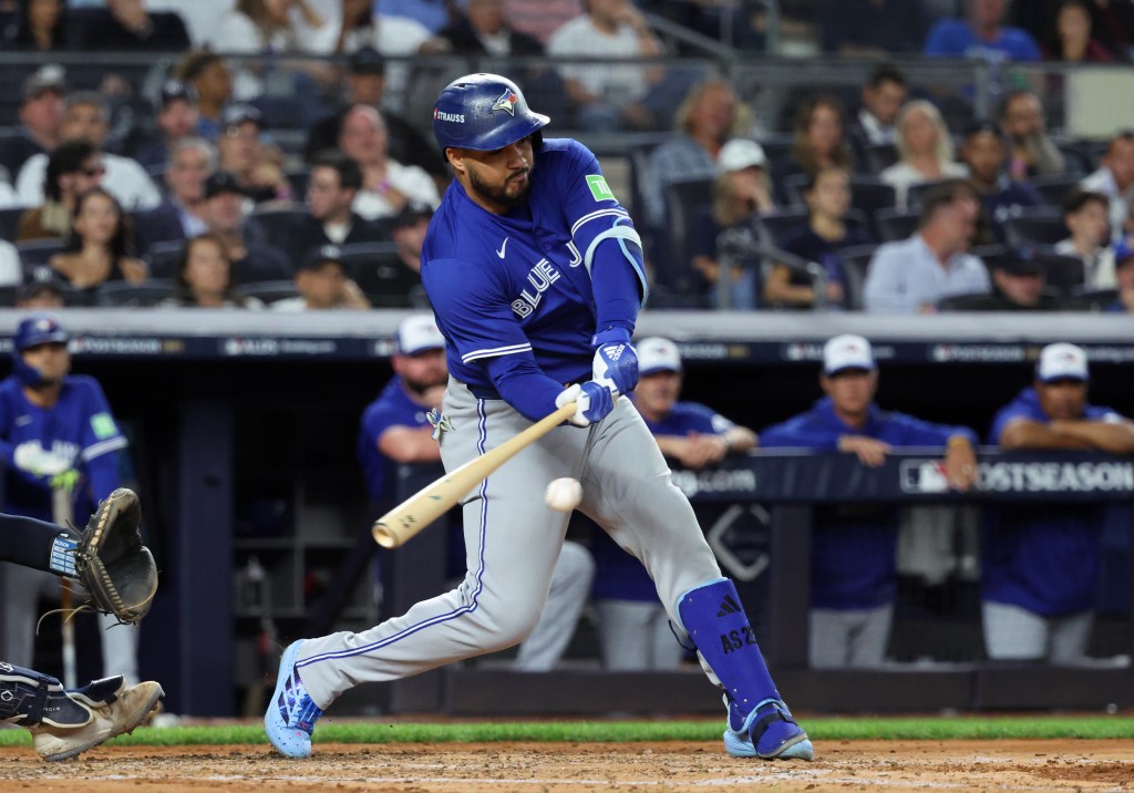 Anthony Santander hitting a baseball during the 2025 ALDS.