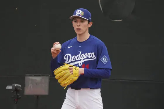 Los Angeles Dodgers pitcher Roki Sasaki (11) throws in the bullpen during spring training camp.