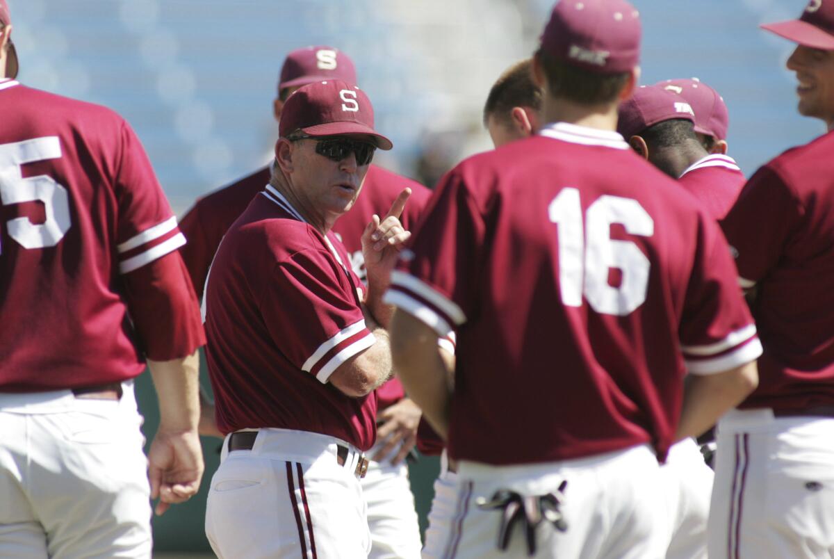 Stanford coach Mark Marquess (wearing sunglasses) talks to his team during practice at the 2008 College World Series.