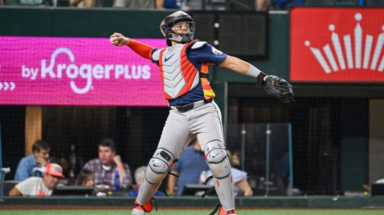 Houston Astros Yanier Diaz throws to second base in the...