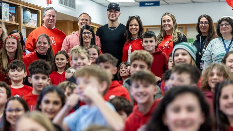 Angles catcher Logan O’Hoppe of Sayville poses for a group...