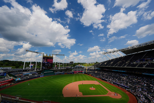FILE - Clouds float above Kauffman Stadium during the sixth inning of a baseball game between the Kansas City Royals and the Washington Nationals, Wednesday, Aug. 13, 2025, in Kansas City, Mo. (AP Photo/Charlie Riedel, File)